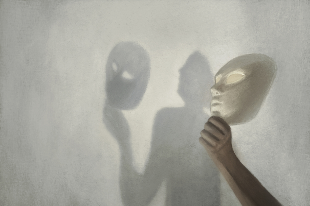 Image of fear behind a mask in grey scale