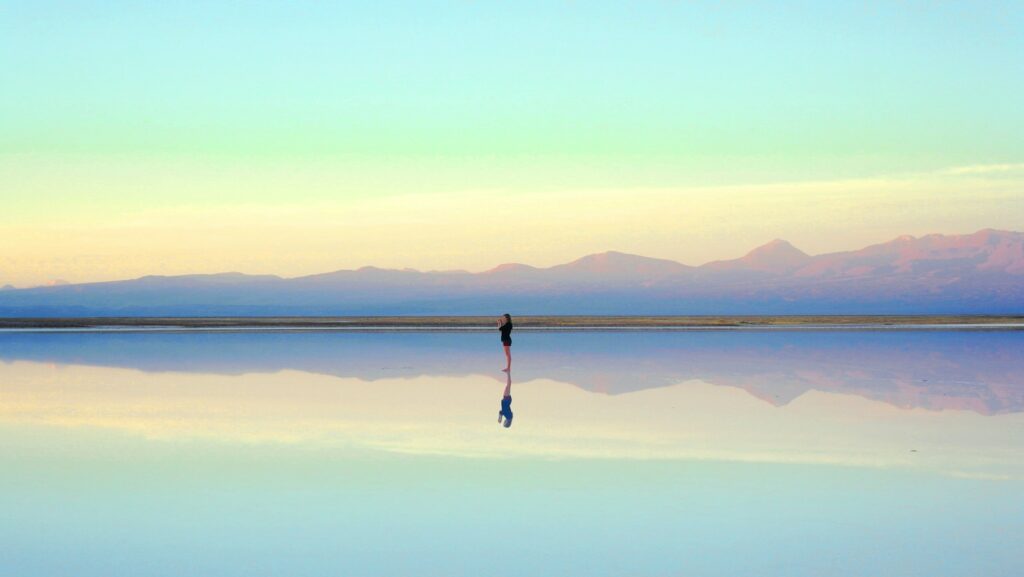 person standing near body of water during daytime