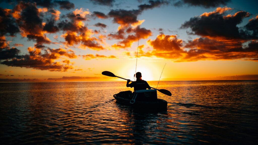 silhouette of person using boat, Person pursuing their passion.