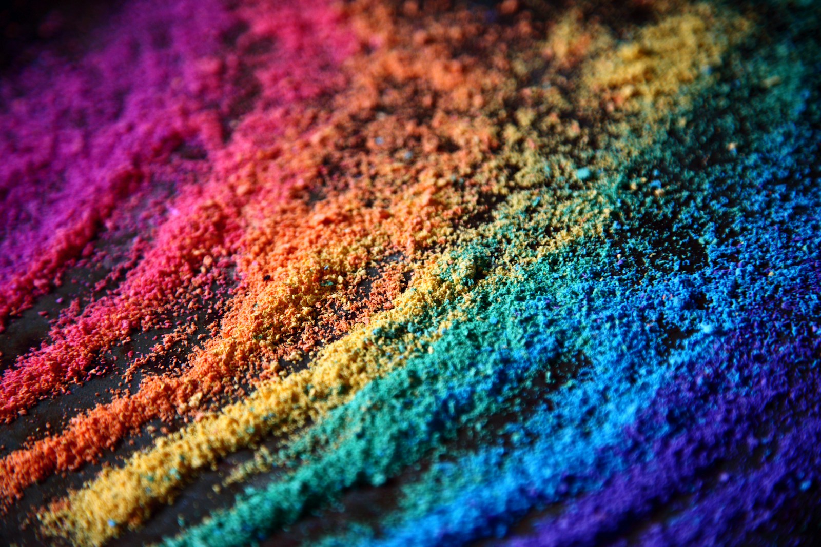 blue and pink textile in close up photography: Pride DEI colours in sand