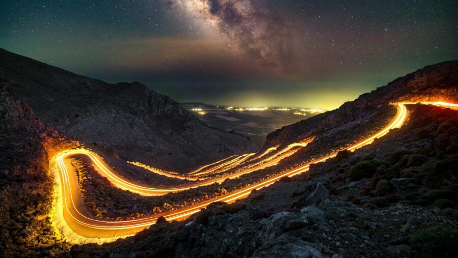 A long exposure shot of a road at night: AI image