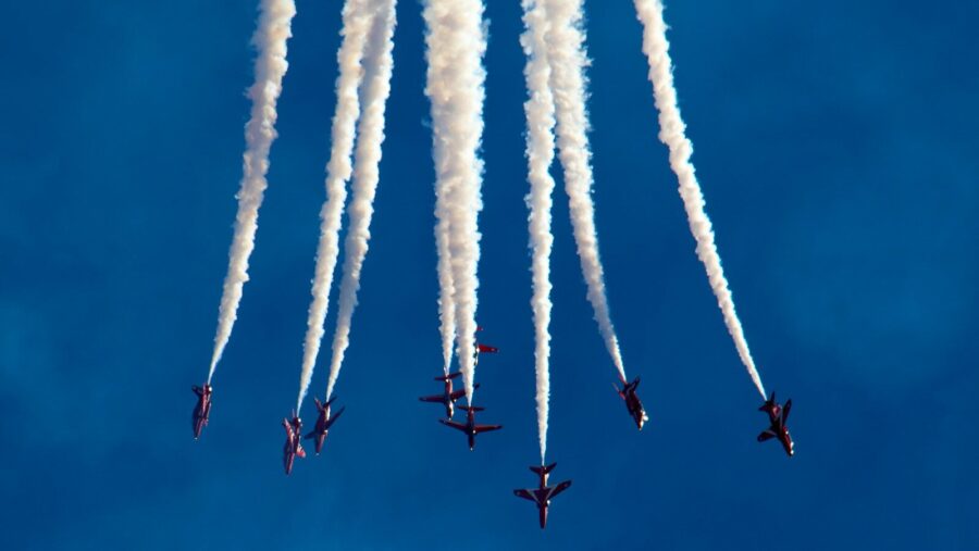 low angle photography of plane contrail, skills-based organisations