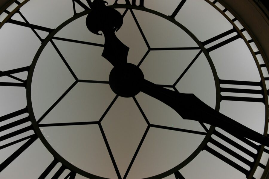 close-up photography of white and black clock. Time, timing concept.