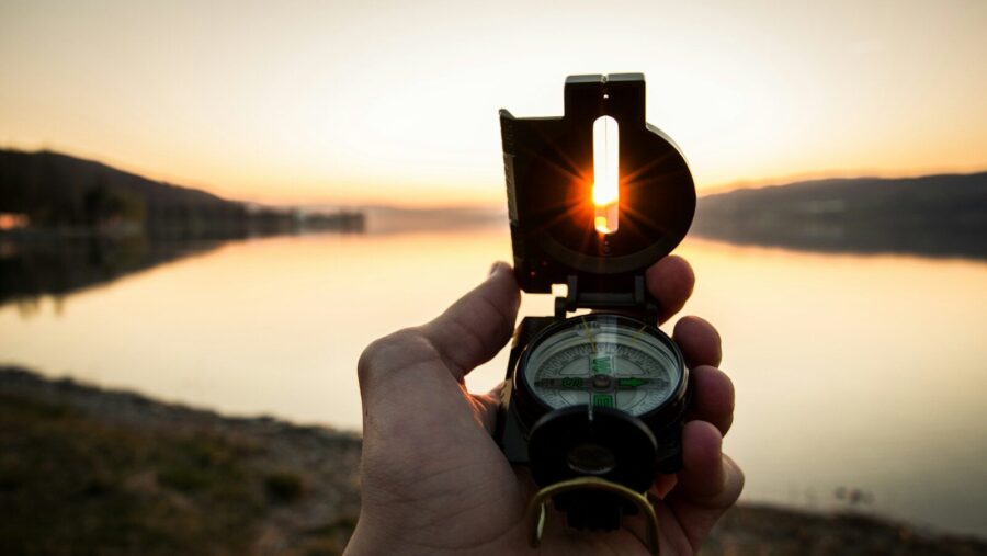 person showing black and white compass: influencing leaders to lead ethically