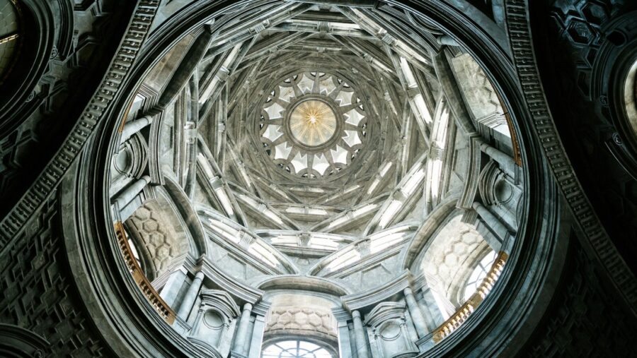 The ceiling of a building with a circular window: management development