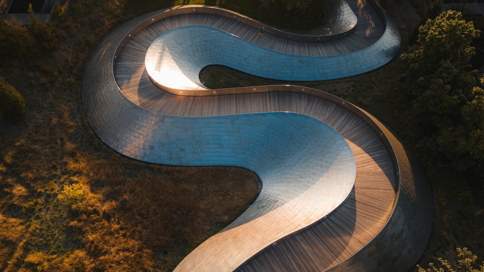 An aerial view of a curved road, onboarding