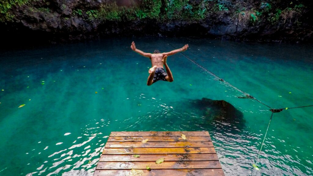 man diving in water, action learning