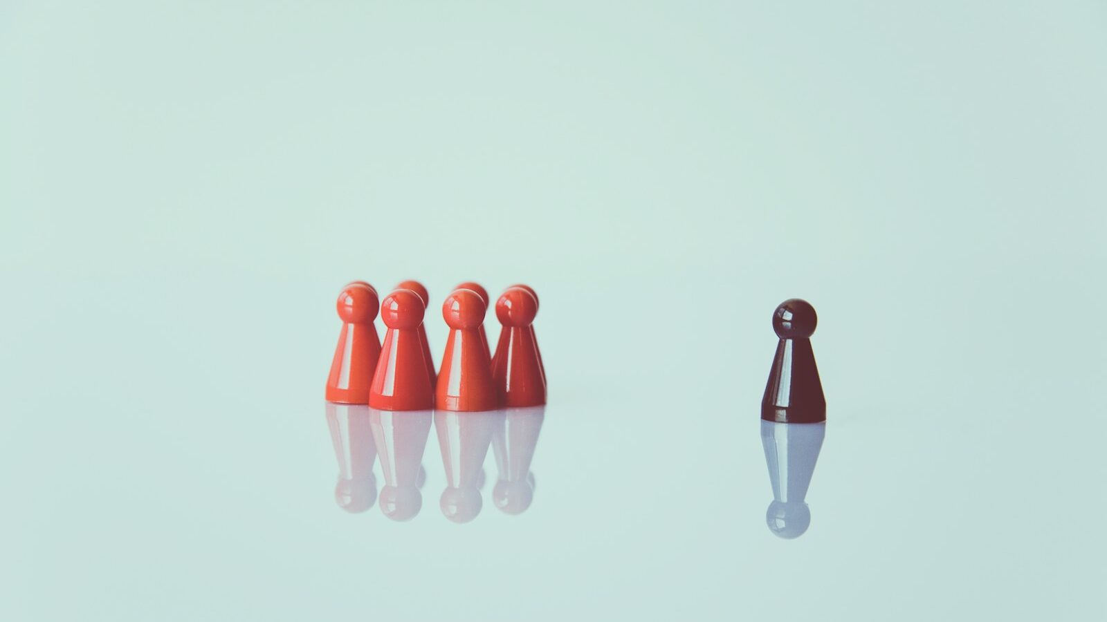brown game pieces on white surface, depicting generational stereotyping