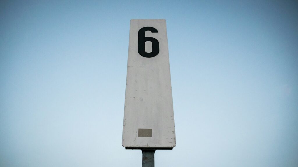 white and black p printed road sign