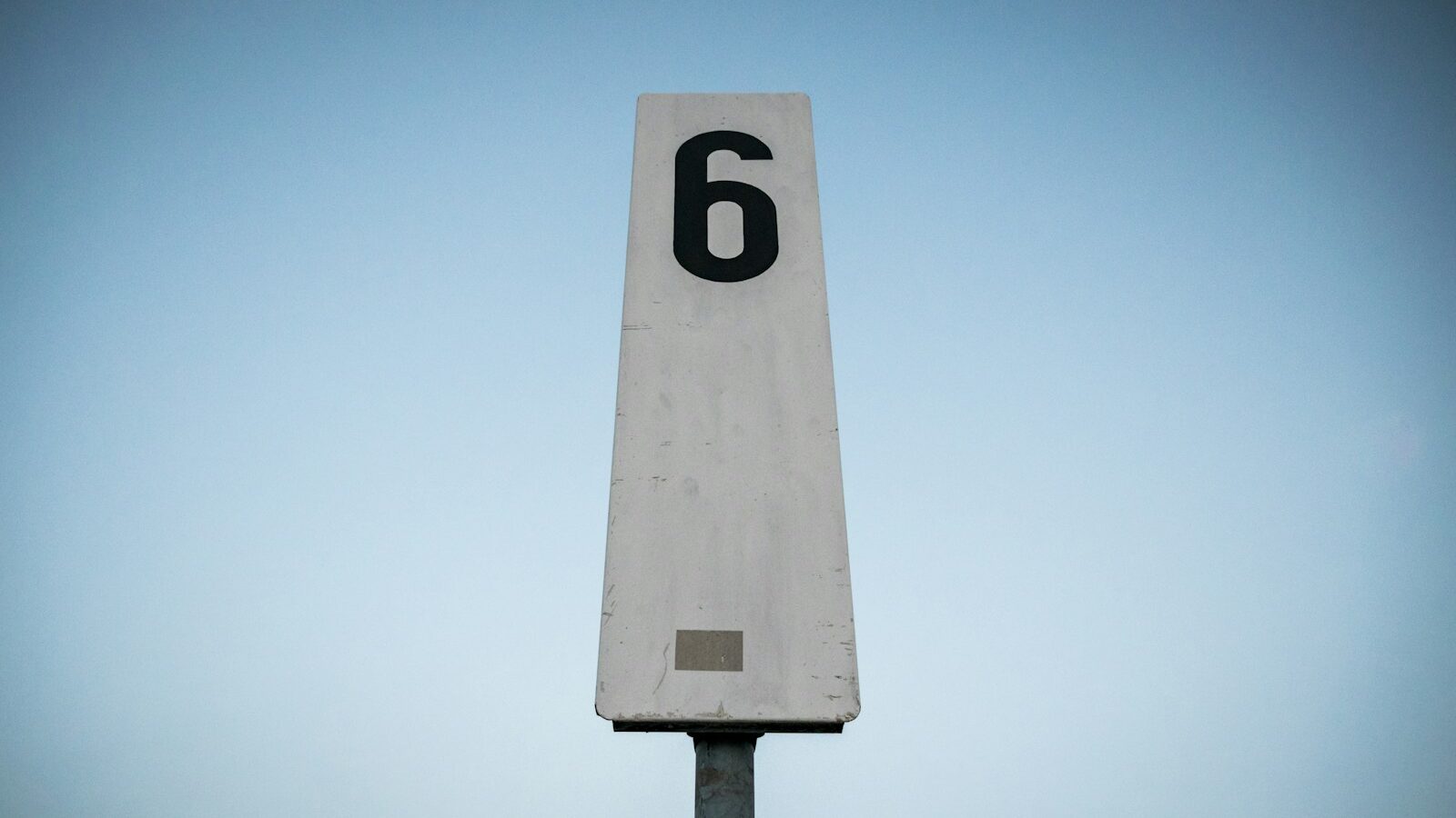white and black p printed road sign