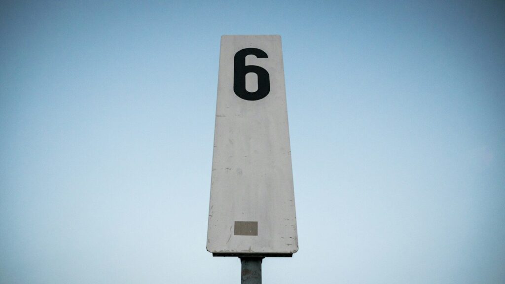 white and black p printed road sign