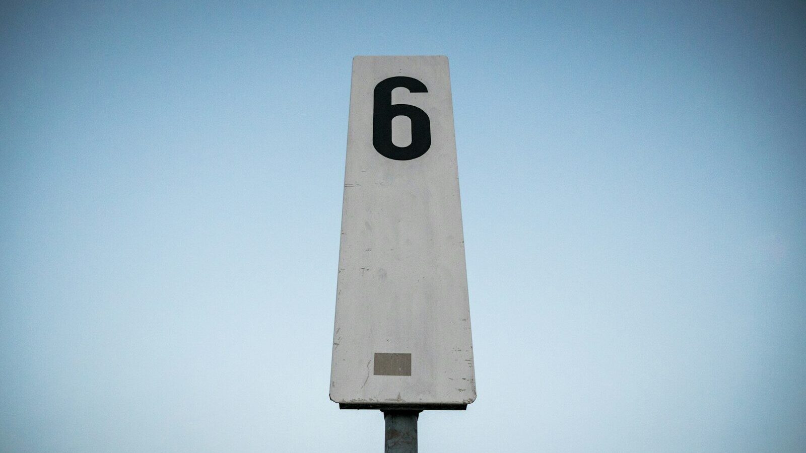 white and black p printed road sign